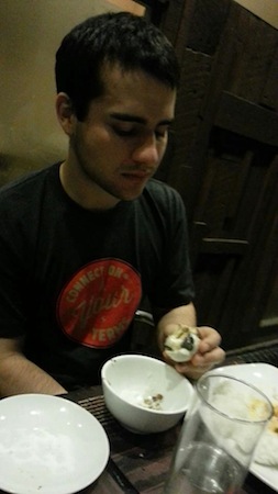 William eating Balut